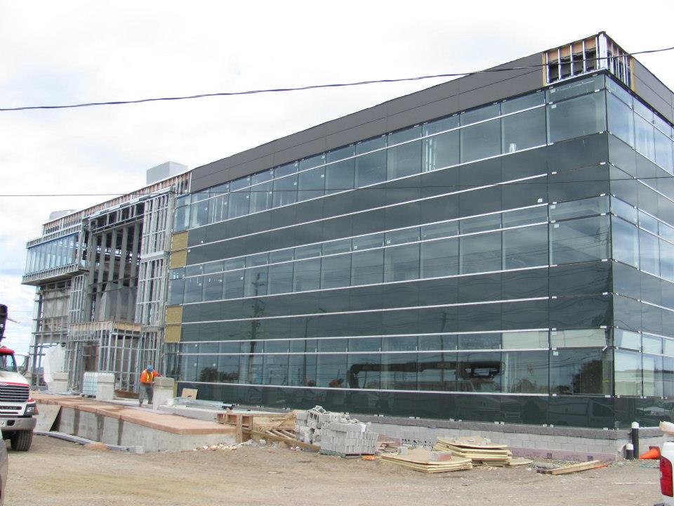 Commercial building exterior with glass facade during construction